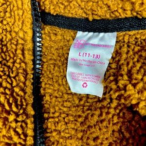 I am selling a brown, (no boundaries),puffer sweater, size is Large (11-13)